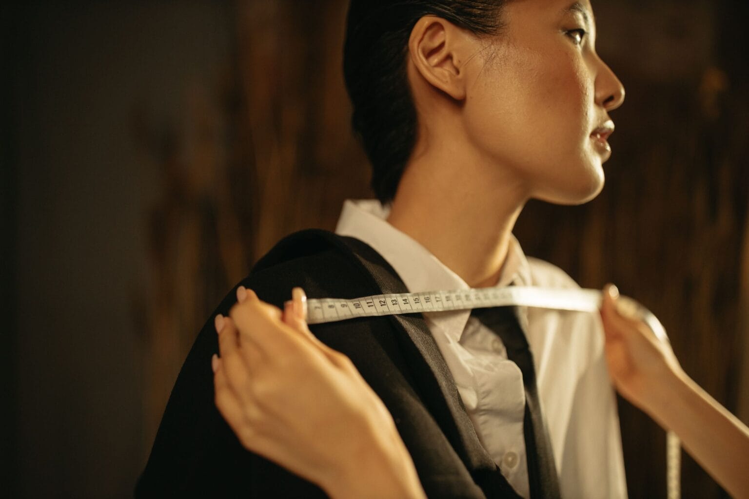 Bespoke tailoring in Italy: measuring a jacket shoulder in the atelier