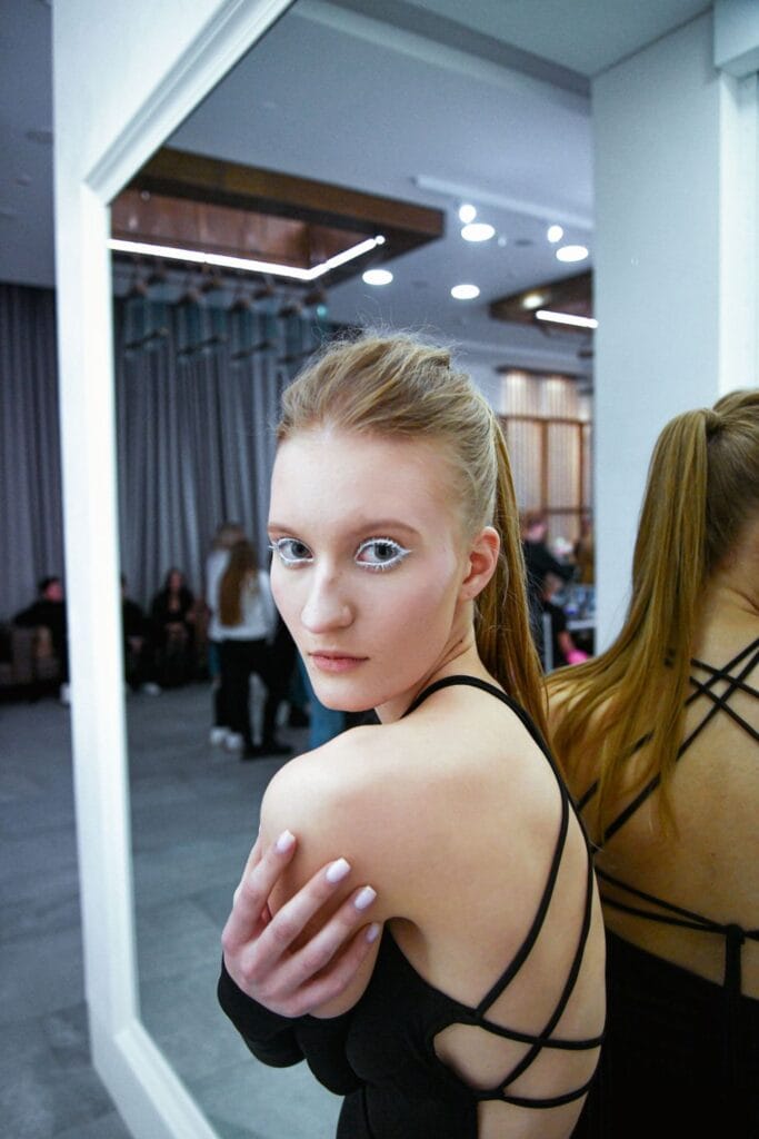 Model moving in a garment designed for movement on the runway