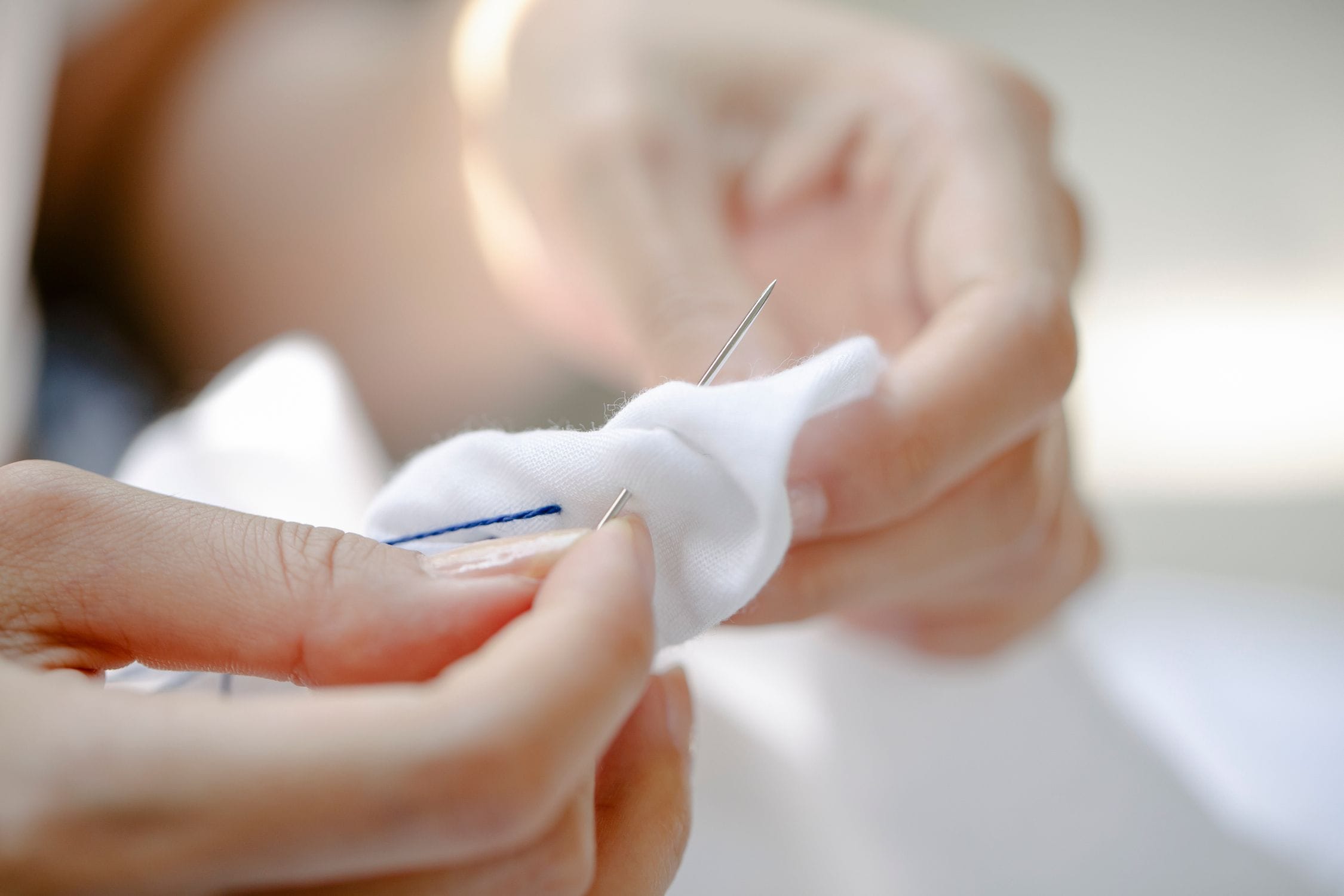 Hand finishing on a structured luxury garment