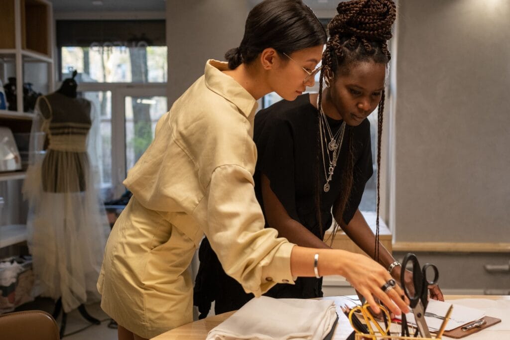 Skilled makers at work in an Italian fashion sample room