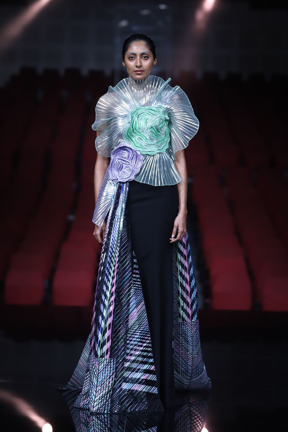 Model wearing an elegant dress on the runway