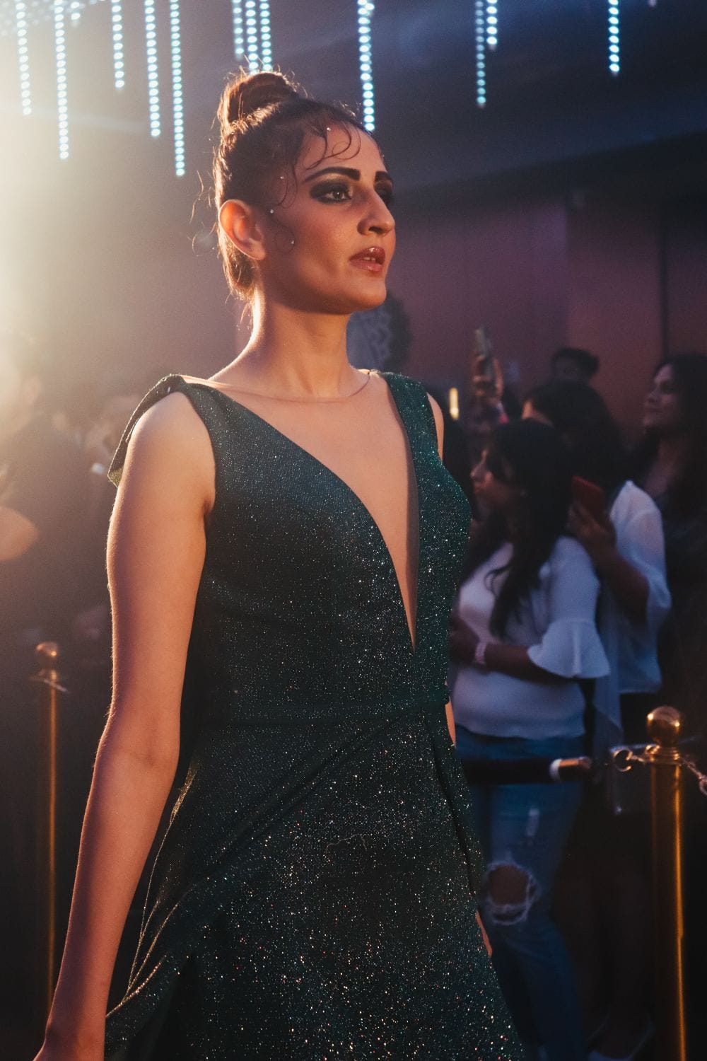 Model presenting a look from a coherent designer collection