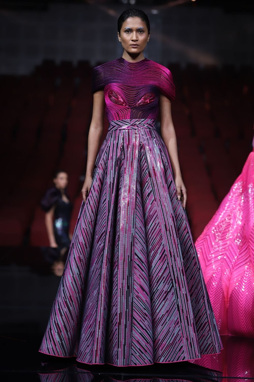 Model wearing an elegant skirt on the runway