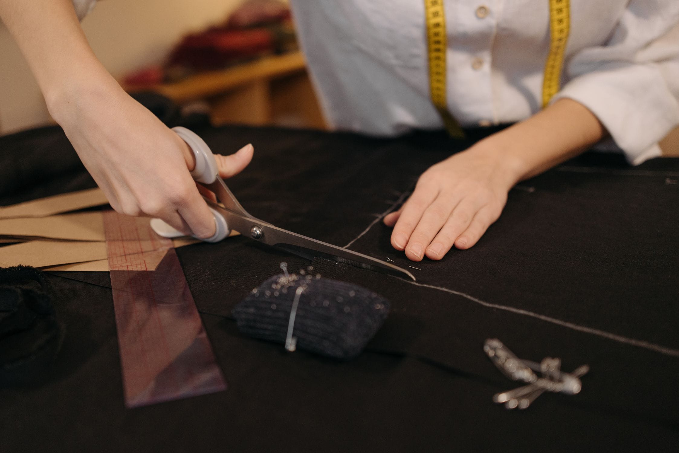 Tailor working on a luxury garment in an atelier