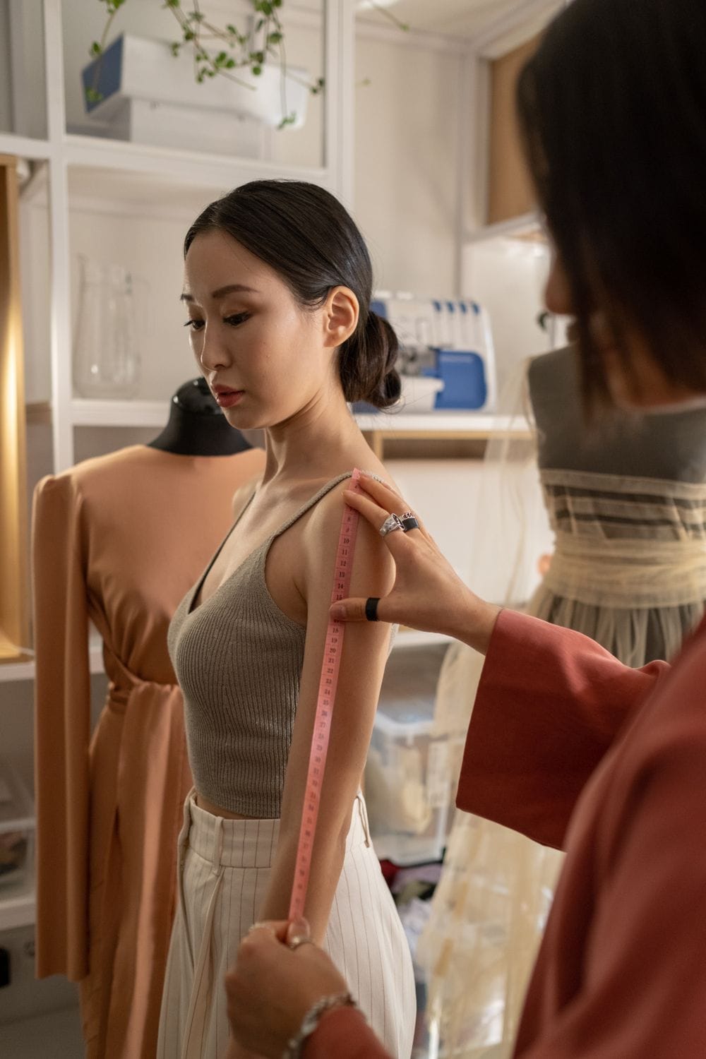 Waistcoat fitted closely on a form in a fashion atelier
