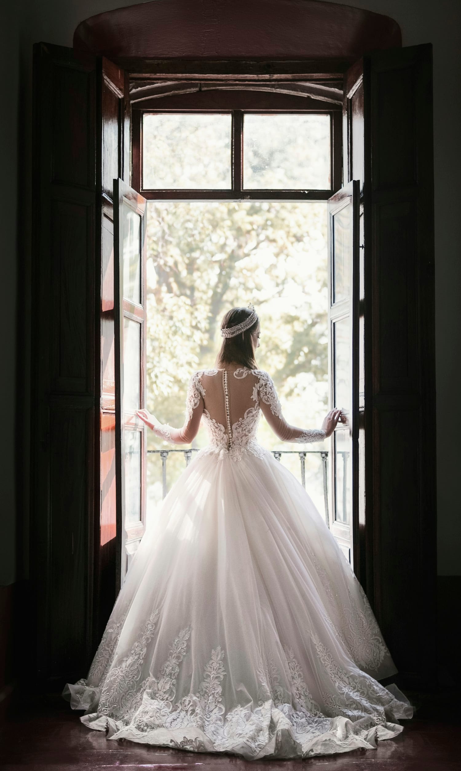 Bridal gown detail near a window