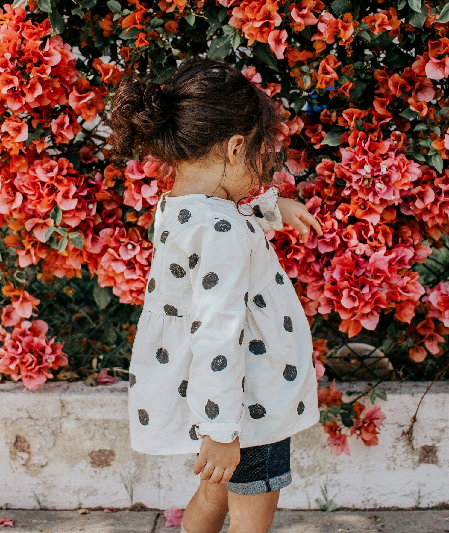 Child in stylish clothing outdoors