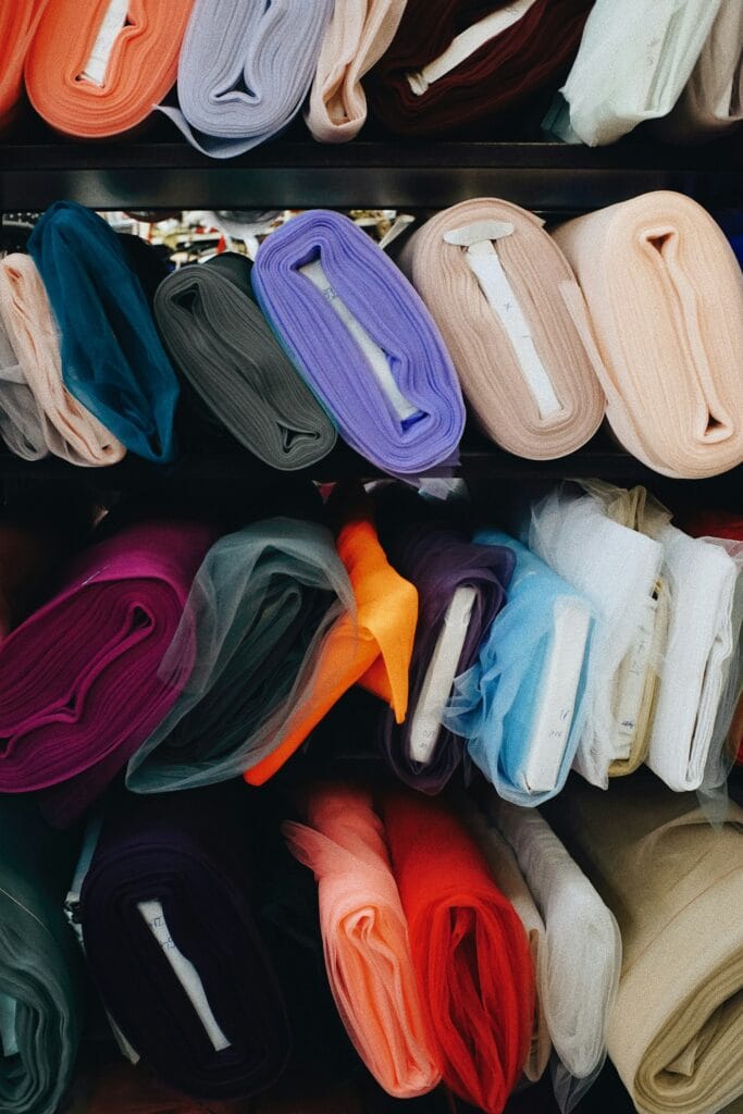 Rolls and bolts of fabric on a shelf