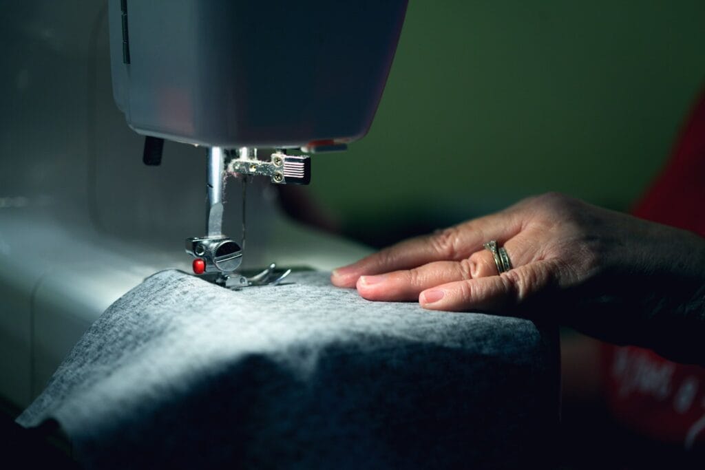 A seamstress at a sewing machine