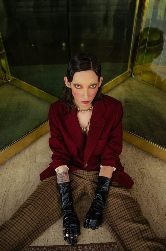 Editorial fashion model in a red blazer