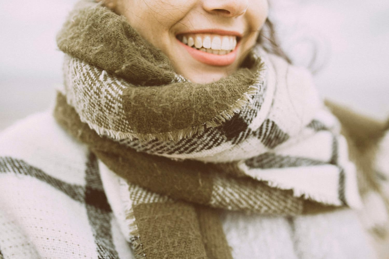 Model in a knitted scarf, editorial
