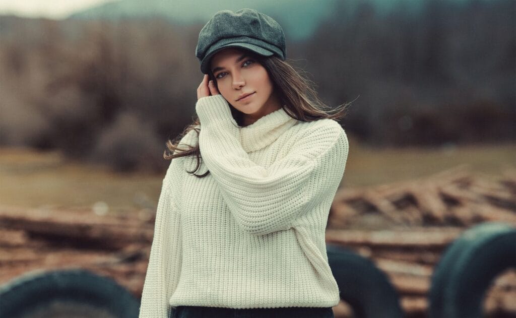 Model in a white knitted sweater