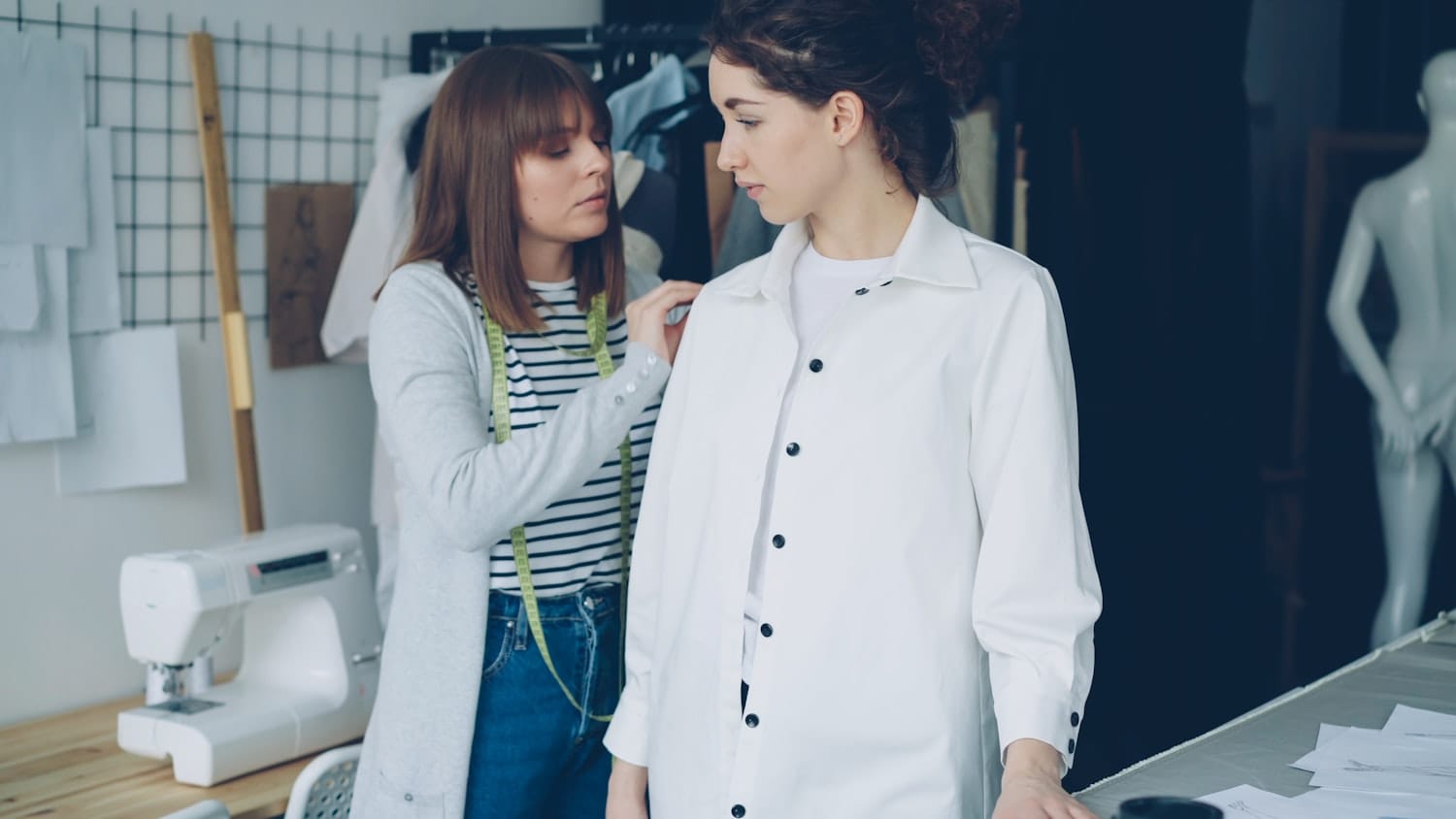 A garment being adjusted on a model