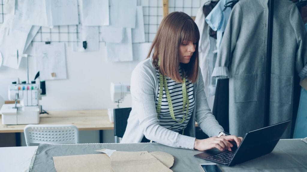 A designer working on designs at a computer
