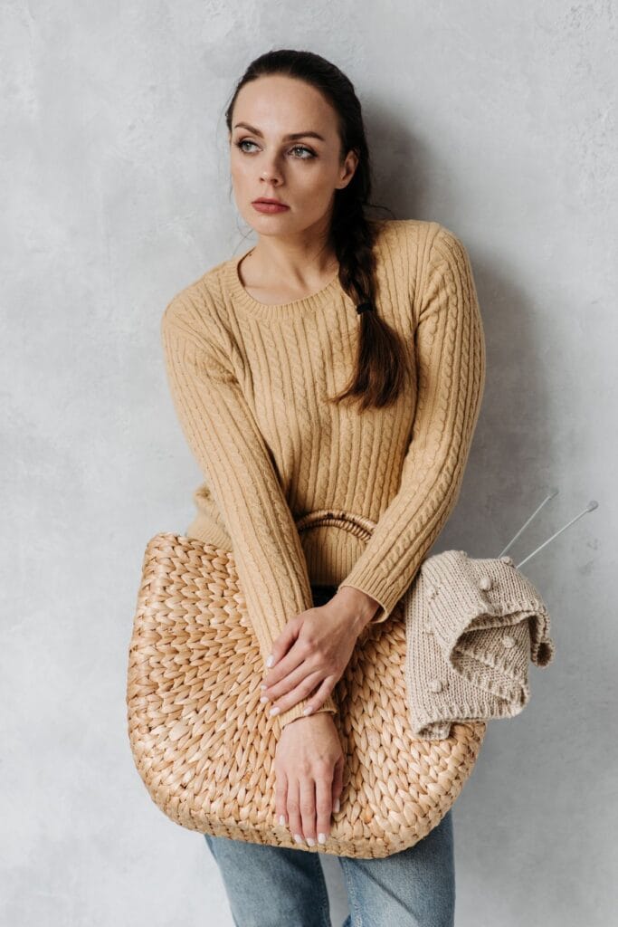 Model in a cable knit sweater