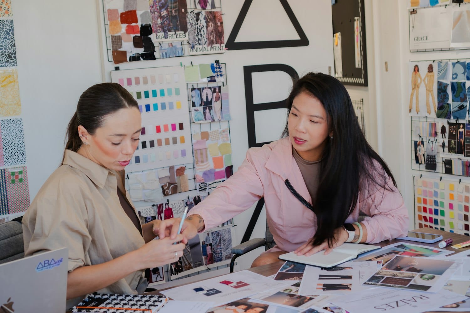 Two people collaborating with fabric swatches