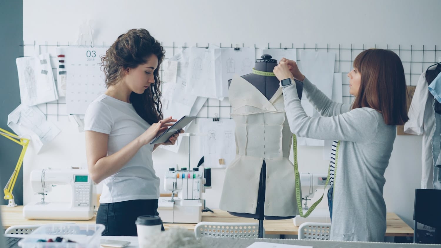Designers working on a dress