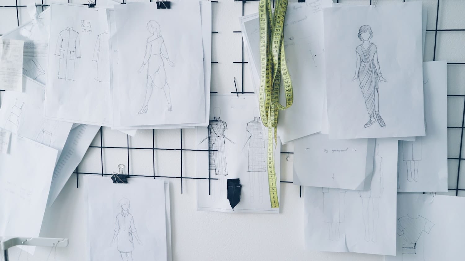 Fashion sketches pinned on a board
