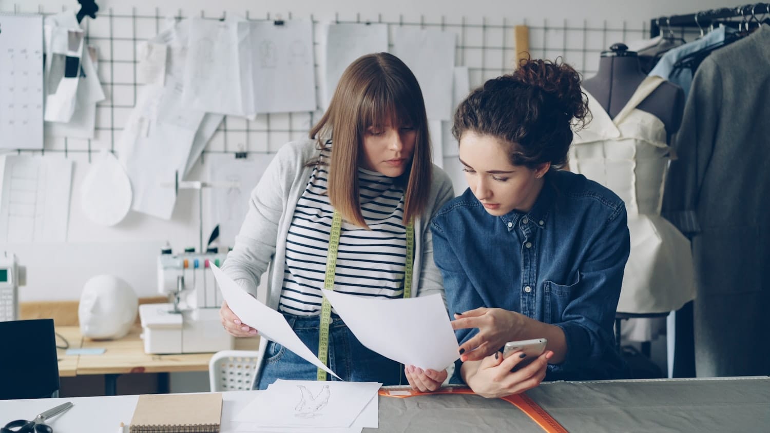 Designers reviewing plans together