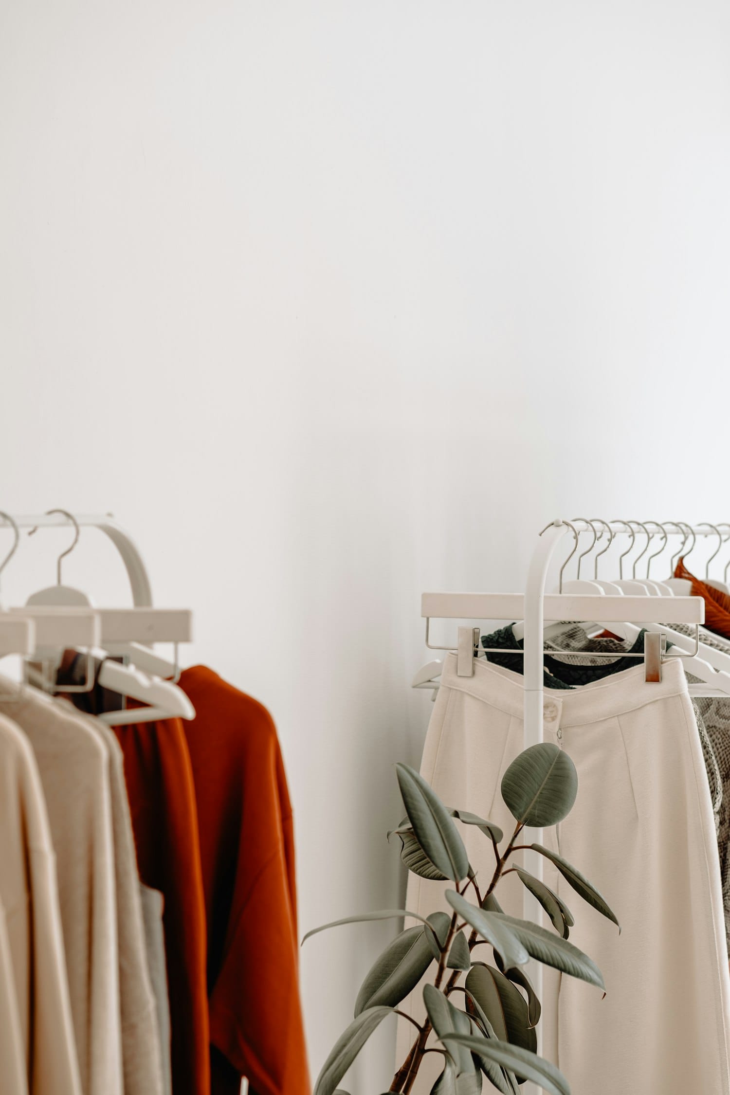 Neutral toned garments on a rail