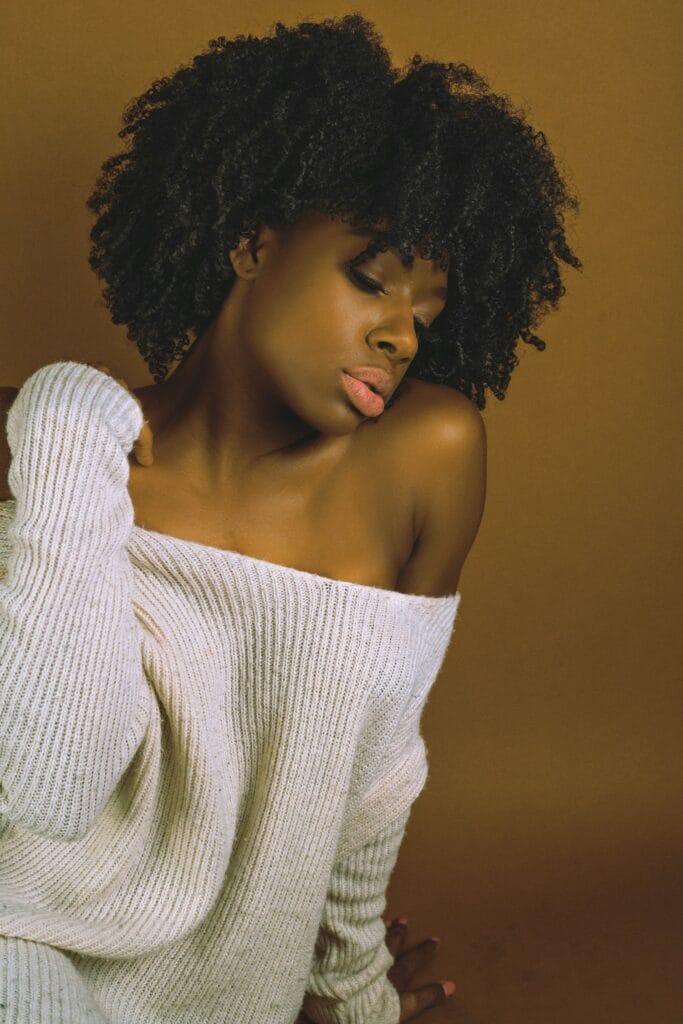 Model in an off the shoulder knit