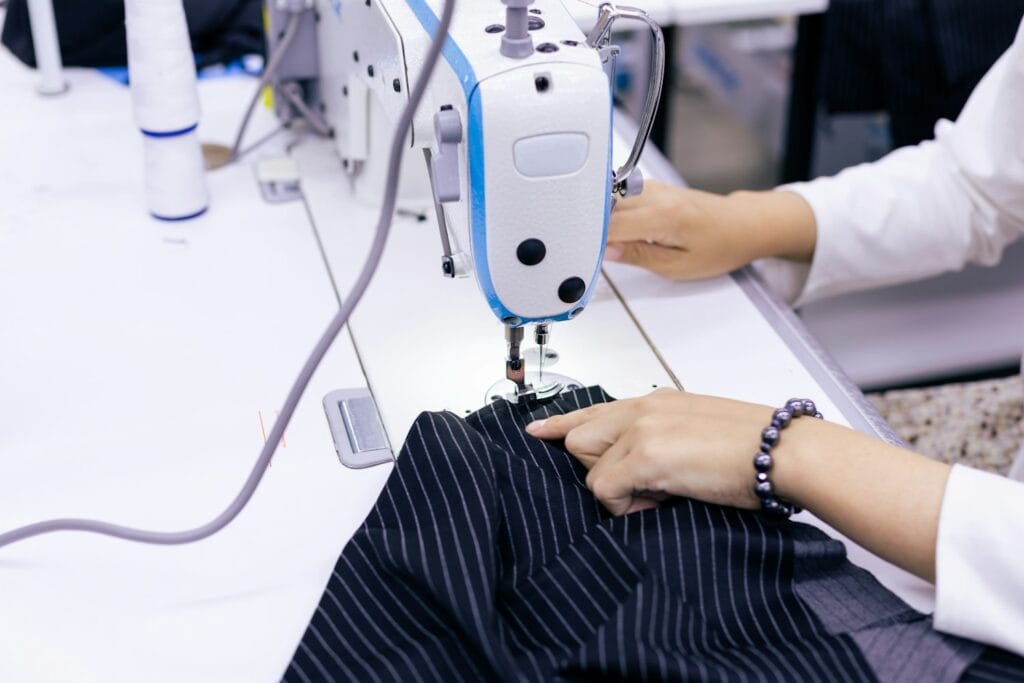 Seamstress working on a garment sample