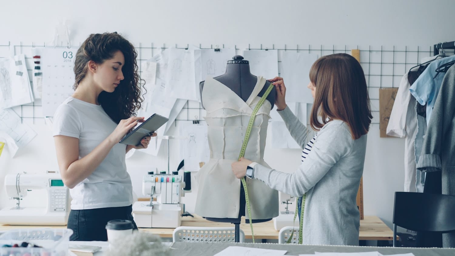 Designers working on a garment in a studio
