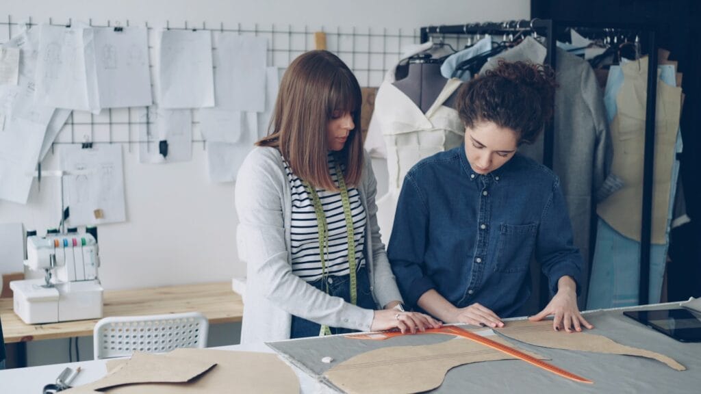 Designers collaborating over a pattern