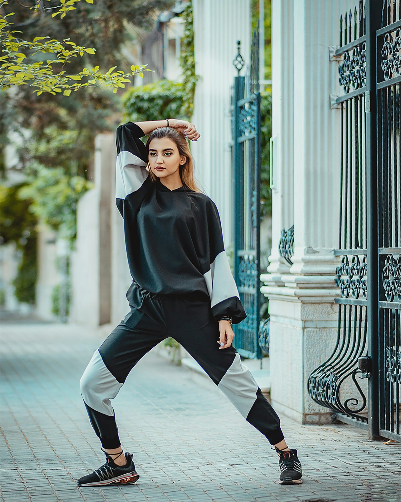 Model in a colour blocked athleisure set on a Milanese street