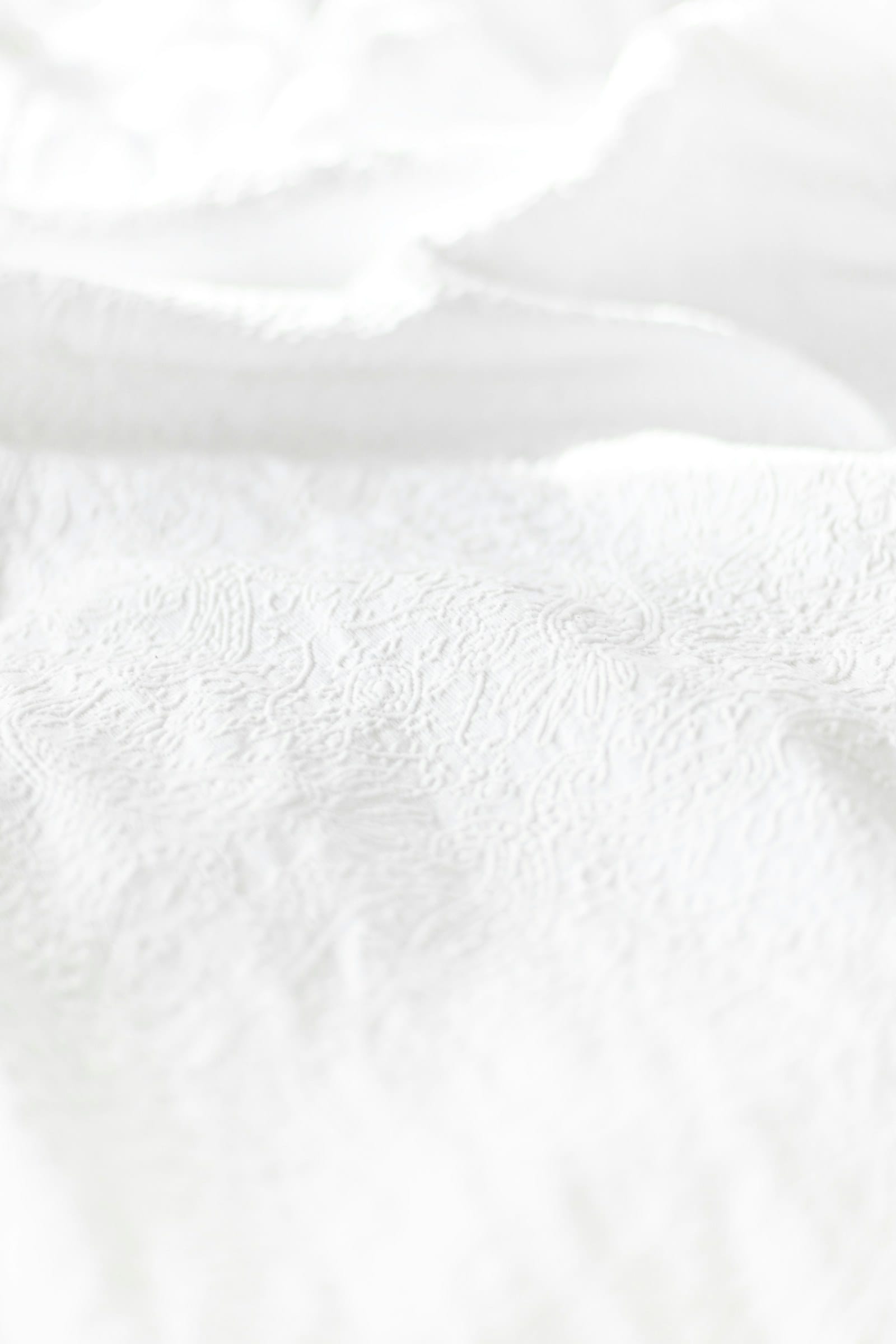Fine white shirting cloth with a woven texture