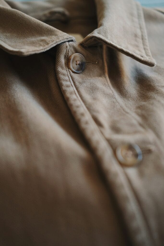 Collar, placket and buttons of a shirt, showing construction detail