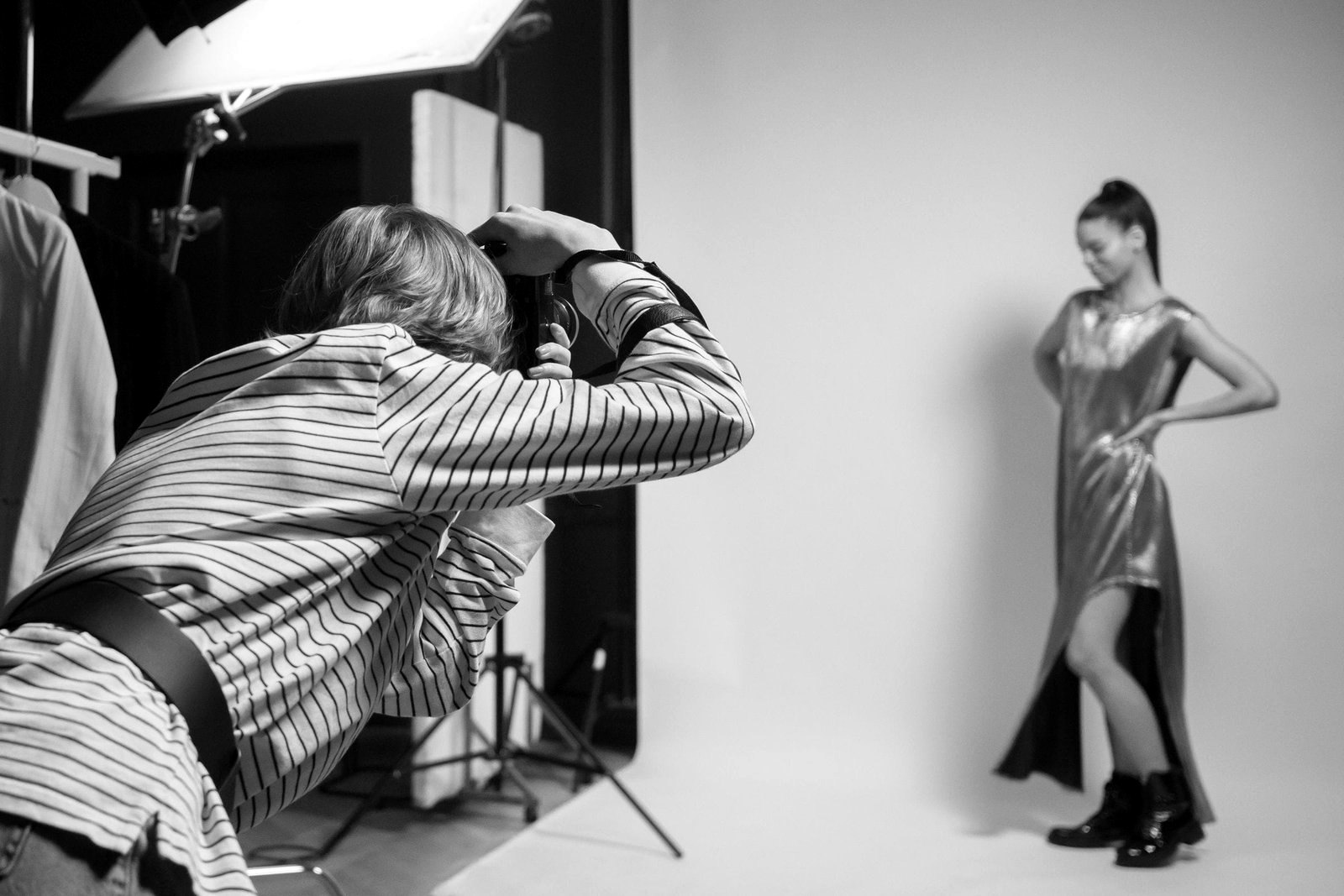 Fashion campaign production in Milan, photographer and model on a studio set